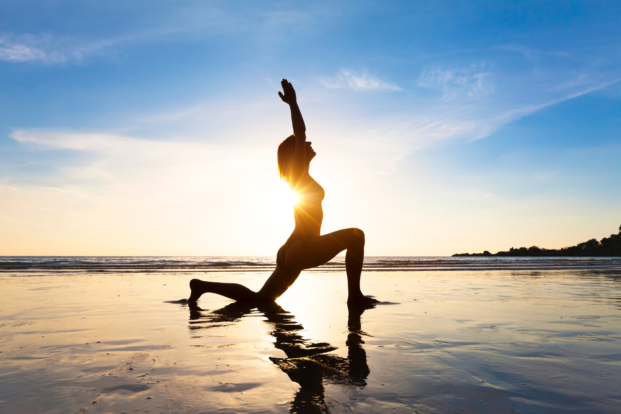 Young woman practicing yoga, concept about healthy lifestyle, beach
